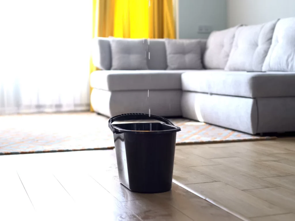 leaky ceiling dripping into a bucket